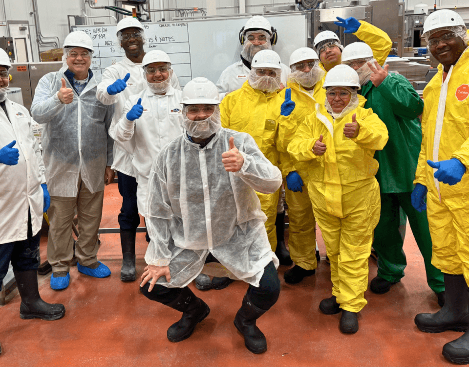 Smiling sanitation team with their thumbs up
