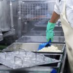Worker in a food production plant